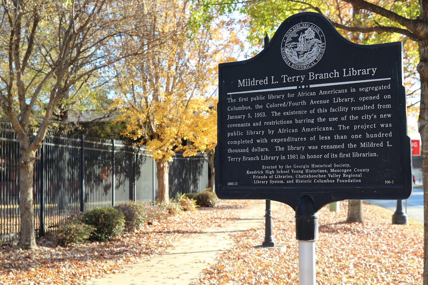 Mildred L. Terry Branch Library Historical Marker Sign, reads: Non Sibi Sed Alis - Georgia Historical Society; Mildred L. Terry Branch Library: The first public library for African Americans in segregated Columbus, the Colored/Fourth Avenue Library, opened on January 5, 1953. The existence of this facility resulted from covenants and restrictions barring the use of the city's new public library by African Americans. The project wa completed with expenditures of less than one hundred thousand dollars. The library was renamed the Mildred L. Terry Branch Library in 1981 in honor of it's first librarian. Erected by the Georgia Historical Society, Kendrick High School Young Historians, Muscogee County Friends of Libraries, Chattahoochee Valley Regional Library System, and Historic Columbus Foundation.