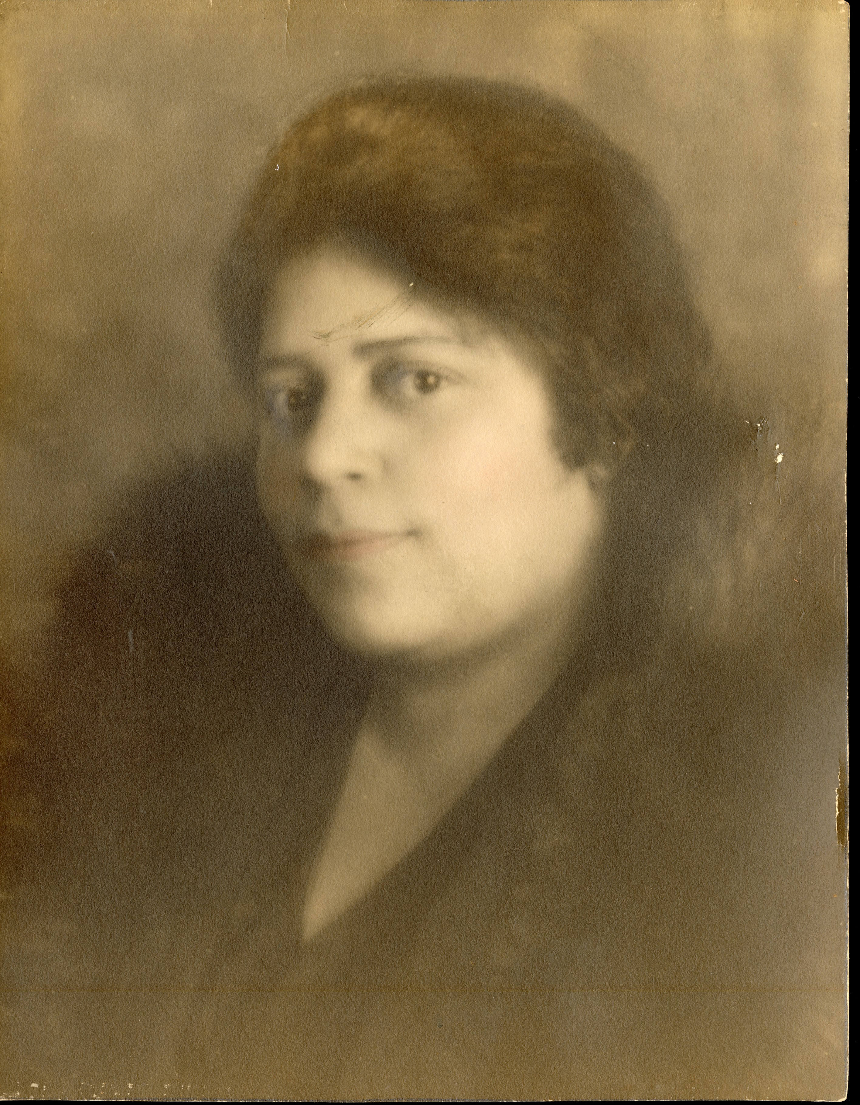 Sepia-toned studio portrait of a woman identified as Alice, taken in 1931. She has dark hair styled in soft waves and wears a dark blouse or dress. She is posed in a three-quarter profile, looking slightly to the side with a calm expression against a plain studio backdrop. (Wm. & Mary Jackson Collection).